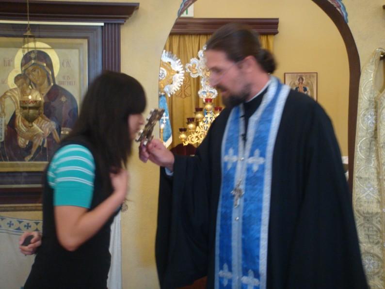 Many years! Alexandra Herbert receives a blessing from Fr.