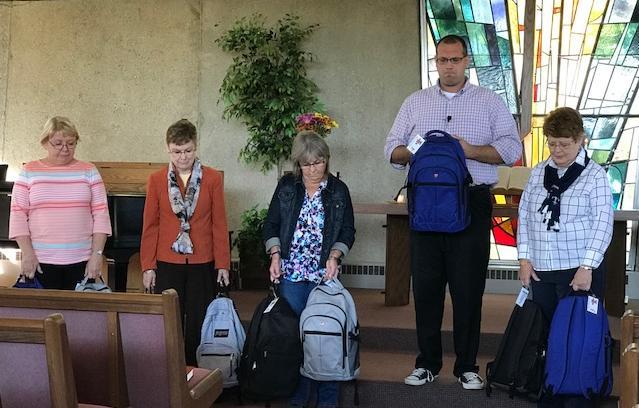 MACC Christmas Concert On Sunday, October 8, Pastor Kevin and our Backpack Ministry Team did a Blessing of the Backpacks.