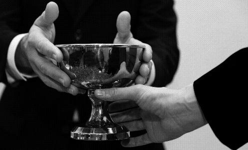 Handing out the communion chalices The inner composure of the minister with