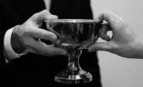 Photo on left: Example of appropriate handing out of a chalice.