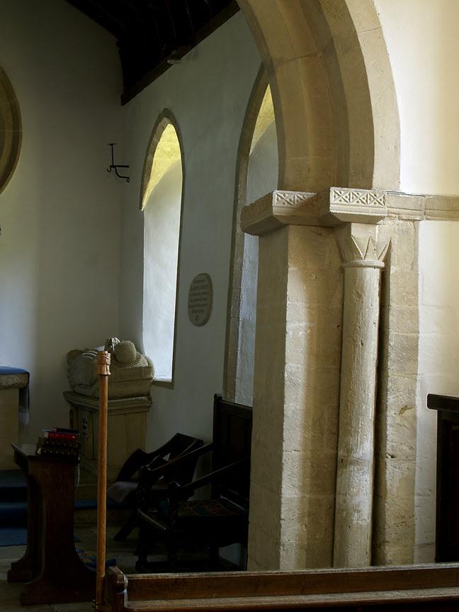 The rose window was probably somewhere in the original Norman apse chancel and then was transferred to the flat east wall
