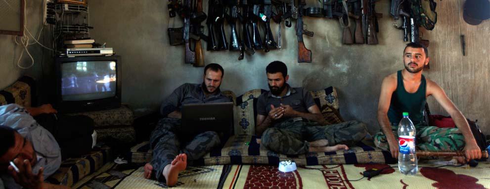 12 of 26 10/5/2012 12:29 AM Free Syrian Army fighters sit in a house on the outskirts of Aleppo, Syria, on June 12, 2012.