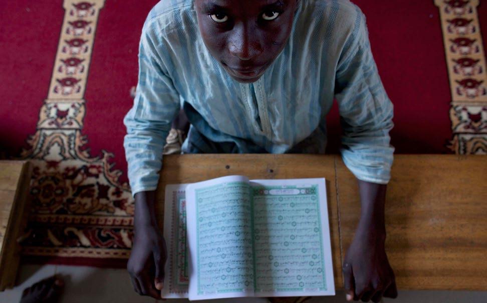 Looking to god: a boy in Mali s capital, Bamako, studies the Koran at Al Firdauss Islamic school where the director, while denouncing violence by jihadists in the north, wants Mali to be an Islamic