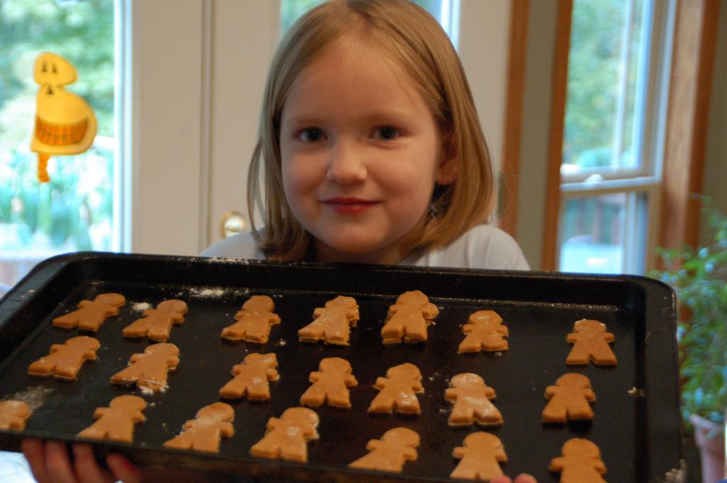 Use cookie cutters to cut out gingerbread people.