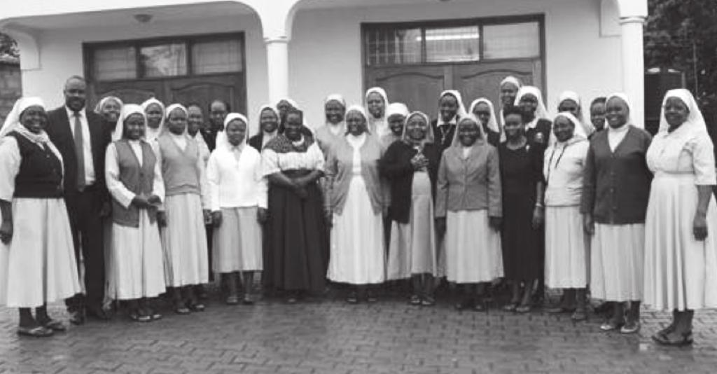 FIGURE 3. THE SECRETARY GENERAL OF THE ASSOCIATION OF RELIGIOUS IN UGANDA WITH PARTICIPANTS OF AN ASEC ADMINISTRATION WORKSHOP Source: ASEC, used with permission.