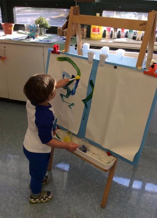 The students in Early Childhood 2 were given blue and yellow paint on the