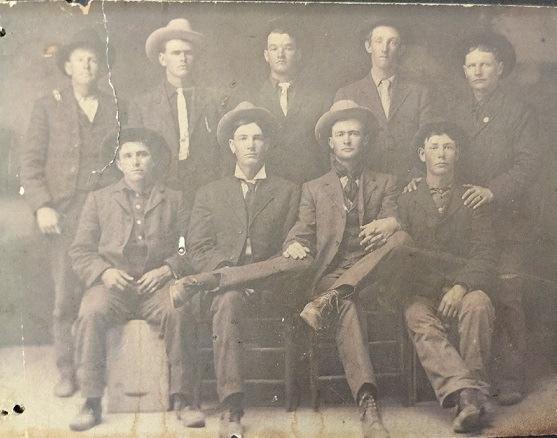 The Society has had an inquiry from Tracy Bale Flowers. She is hoping that someone might recognize some of the men in the photograph below.