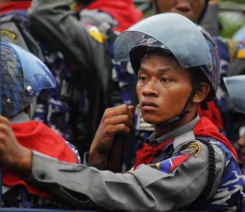 Policemen arrive in their vehicle during fighting between Rakhine Buddhist and Rohingya Muslims in Sittwe, Arakan State of western Burma on June 10, 2012 Photo: Reuters Buddhists, police officials,