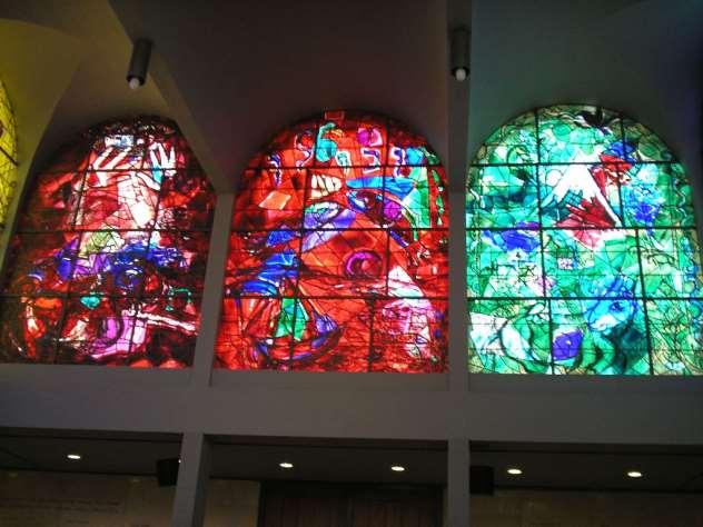 Chagall Windows -Judah, Zebulah,Issachar -- SOUTHERN VIEW 1. Judah - rich red; hands; city of Jerusalem; lion 2. Zebulah - fisherman, boat, fish 3.