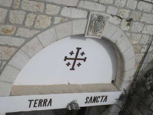 Walk on the Ramparts - Terra Sancta [Terra Sancta = Holy Land] Jerusalem Cross indicates Franciscan Order custody of Holy Land.