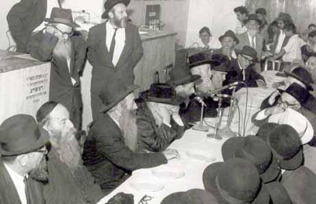We waited for the Rebbe to come out to us for the farbrengen This Chassid was talking to us and his eyes became enflamed as if boring through us and flying far away, carrying his thirsting spirit