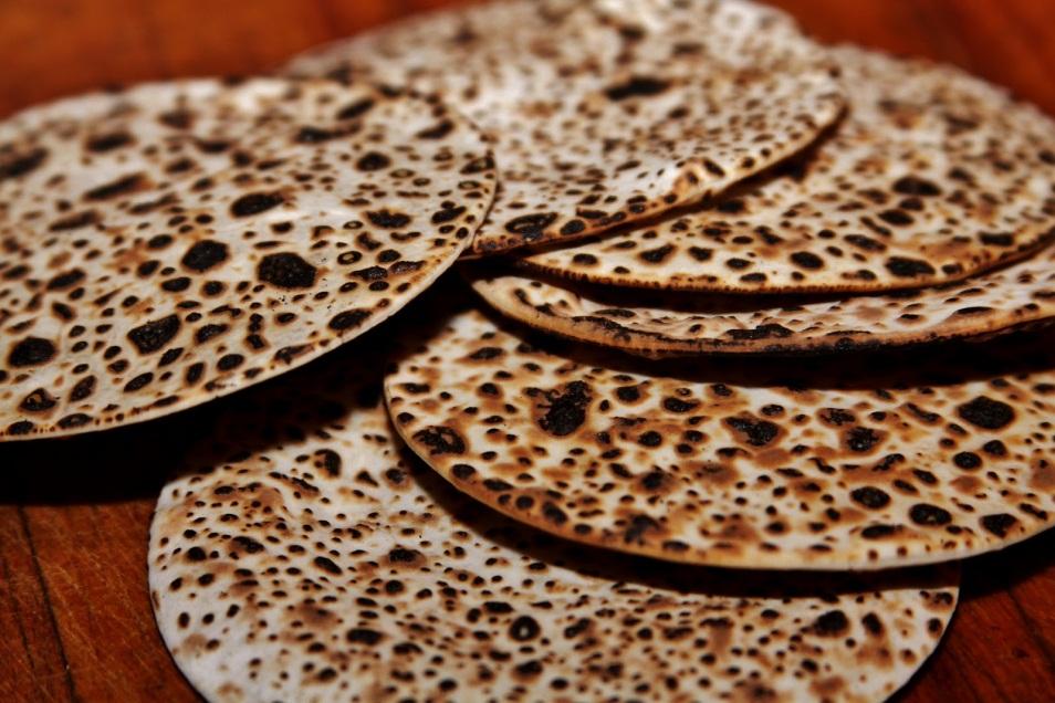 Passover The classic Seder food is matzo, unleavened bread prepared in large flat sheets that snap when you break them.