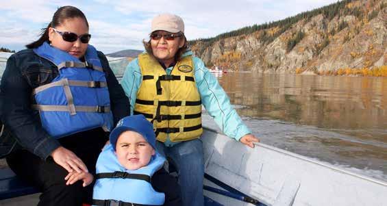 This is my mom and my grandma. We are on our way to Moosehide village by boat.