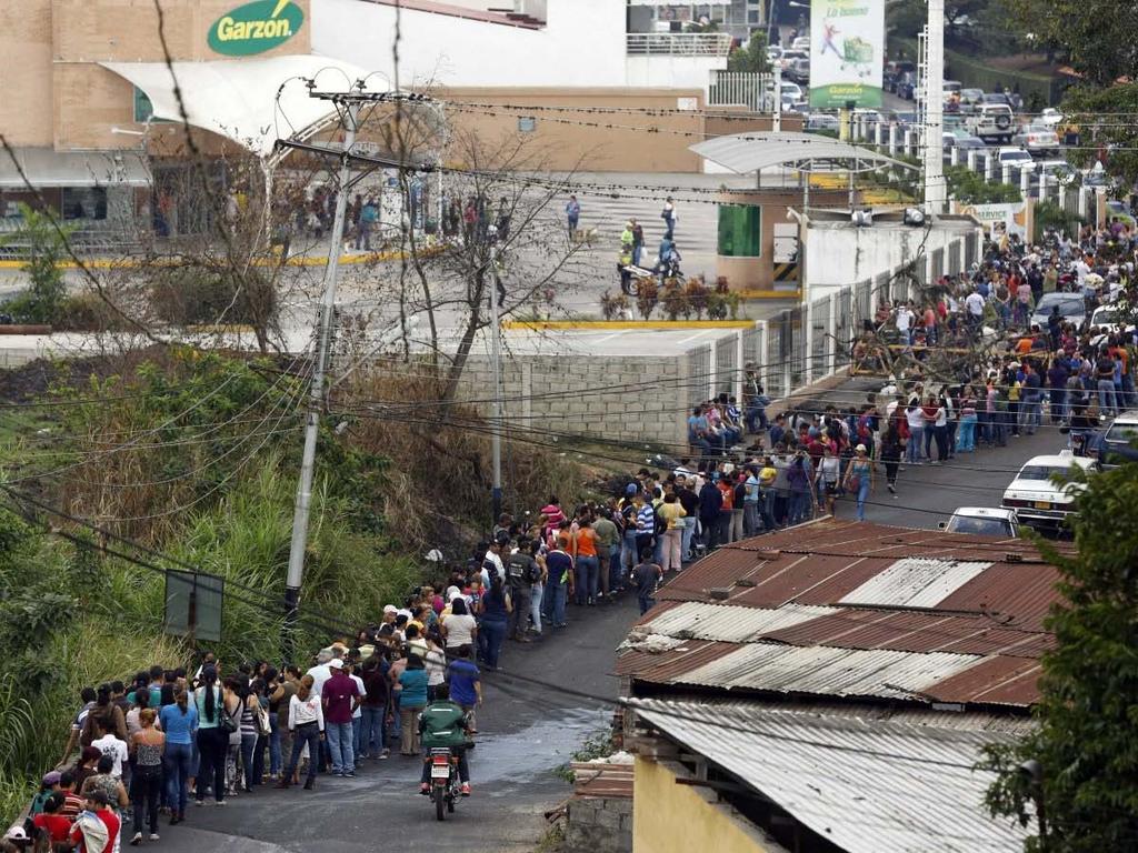 People have to wait in long lines to buy basic items like bread, milk, rice, beans, soap, toothpaste, paper