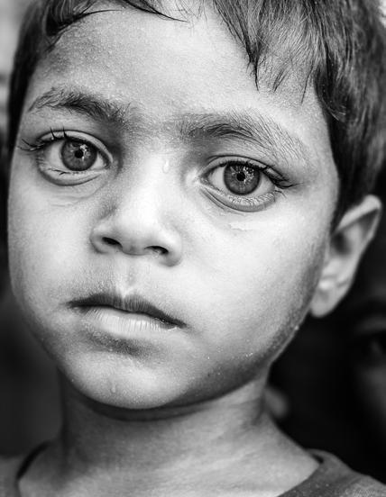 A young Rohingya boy, one of thousands of unregistered displaced children, outside Sittwe, Rakhine State, April 2013.