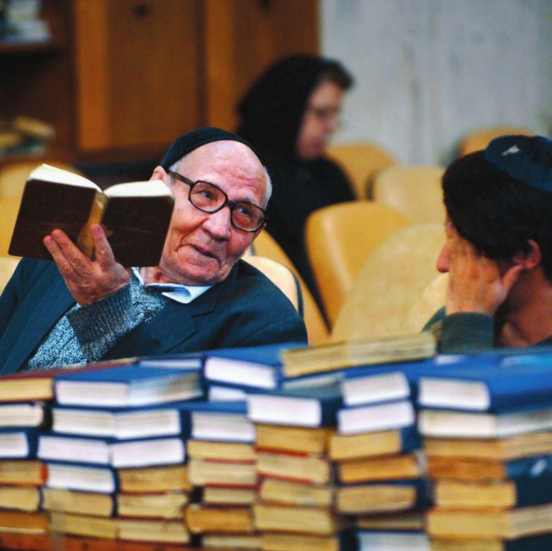 Below: An old man talks to a younger man during prayers in the synagogue on Philistine Street, Tehran. There are approximately 25,000 Jews in Iran, their number ever decreasing.