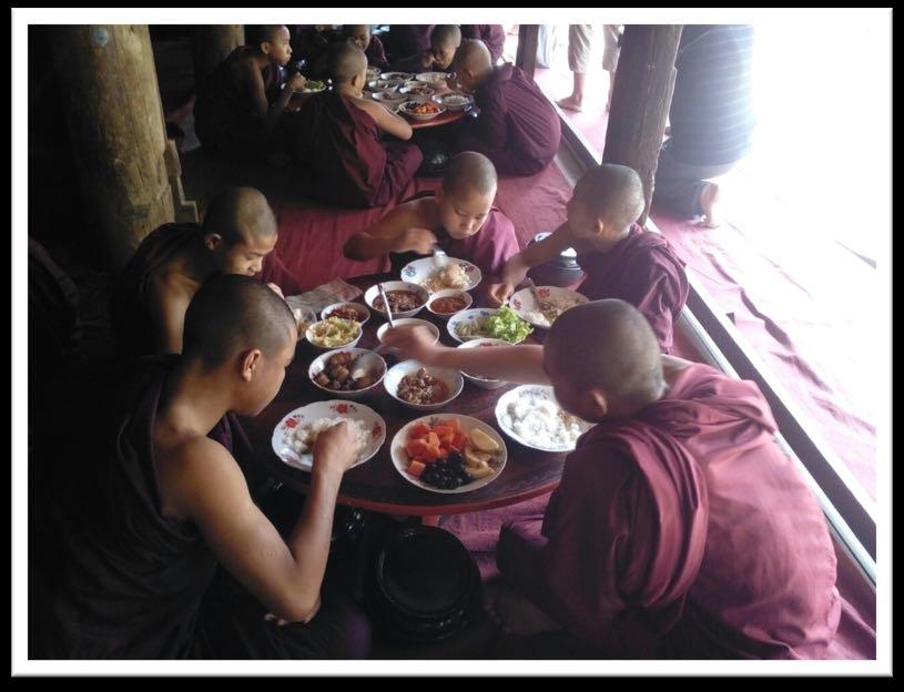 their lunch in the compound of Taung-bi Nat
