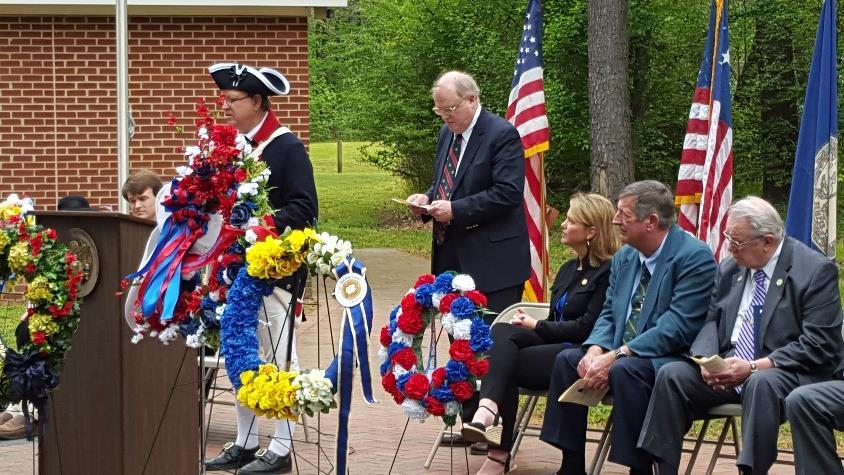 President James Monroe Birthday Celebration On the right, Richard Newsome, Williamsburg Chapter SAR member, stands with the wreath that he presented in the name