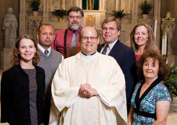 Surrounding their newly ordained brother are Kent s siblings: Denice, Glenn, Norman, Jon, Laurie, and Andrea.