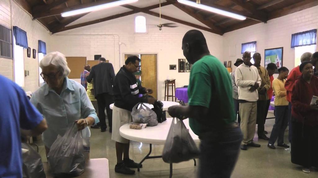 The volunteers do much more than just hand out bags of food. They raise funds and solicit donations of various kinds.