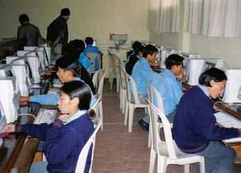 Bottom: Students at the Sambhota School in the Tibetan settlement at Poanta, India, studying word processing and other computer skills.