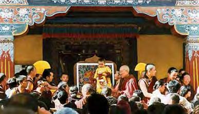Rinpoche blessing devotees assisted by Bokar