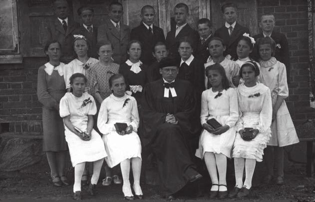 2. the soviet occupation Pastor Jurgis gavėnis with the Jurbarkas confirmation class before the doors of the Jurbarkas parsonage, May 24, 1942. Mindaugas Kairys collection.