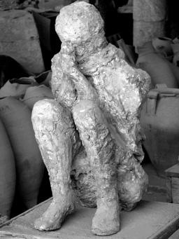 11. Pompeii in 79 AD The picture below shows the plaster cast of a victim found in Pompeii.