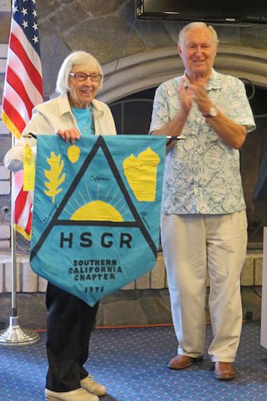 Cathy Clark, Herman Wildermuth holding her banner May