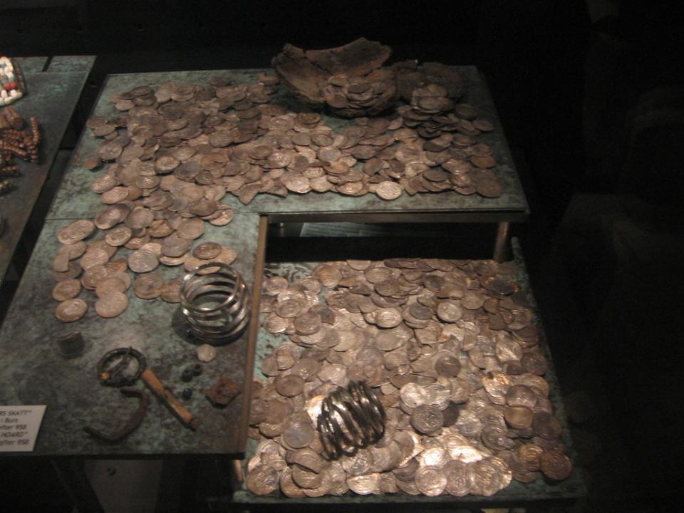 A sample of silver coins, mostly Arabic dirhams.