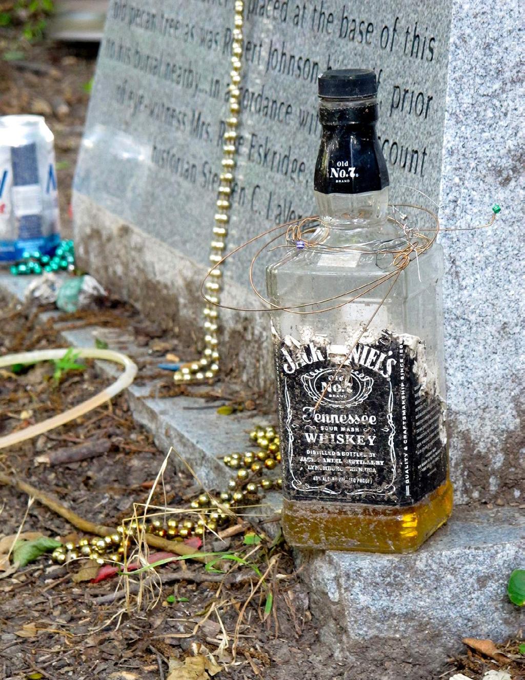 JULY 11, 2013 Fans of Robert Johnson leave gifts like Jack Daniels, beads, beer, glow sticks and guitar picks for the