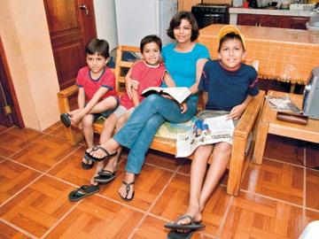 Below: Daniel and Angela Calapucha; Araceli Duran with her children; members of the Galápagos branch who helped build Elena Cedeño s house; the Galápagos Islands Branch meetinghouse.