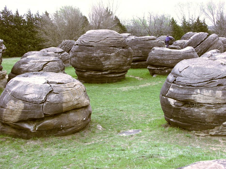 are giant spherical concretions comprised of sandstone tightly cemented by calcite. From 10 to 20 feet in diameter, they sit in a hilltop field overlooking the Solomon River valley in Kansas.