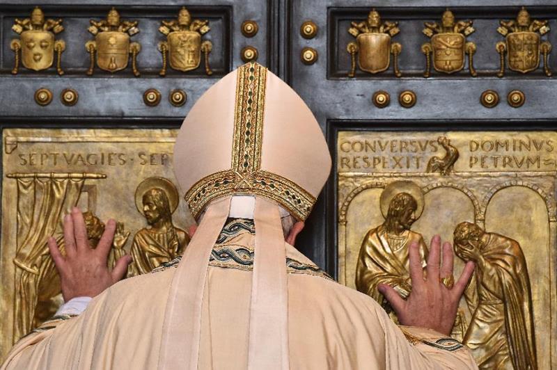Mercy before Judgment December 8, 2015 Vatican City (AFP) - Uttering a centuries-old command, Pope Francis on Tuesday opened a "Holy Door" of St Peter's basilica to kick off an extraordinary Jubilee