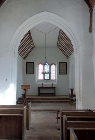 the east window, which was formed of re-used stone when the new east wall was built, is a plain altar.