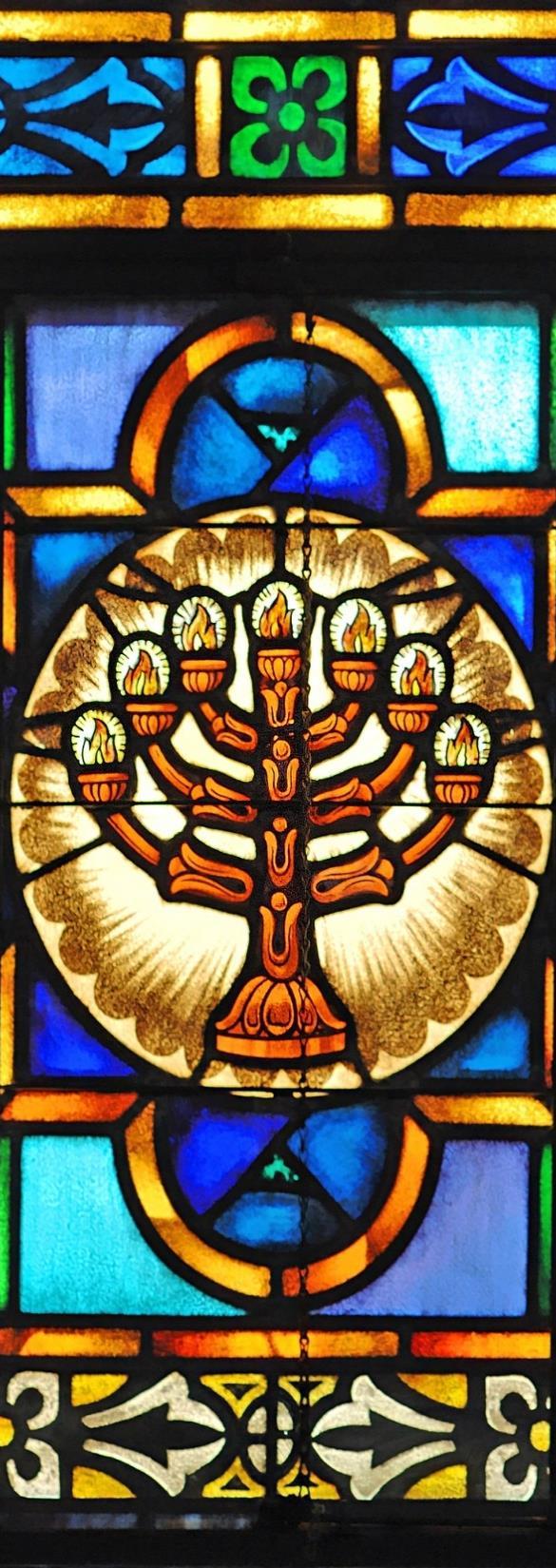 When John turned back to look in the direction of the voice speaking to him, he first saw the Temple menorah a seven-branched lamp that was once located in the Holy Place in the Temple in Jerusalem.