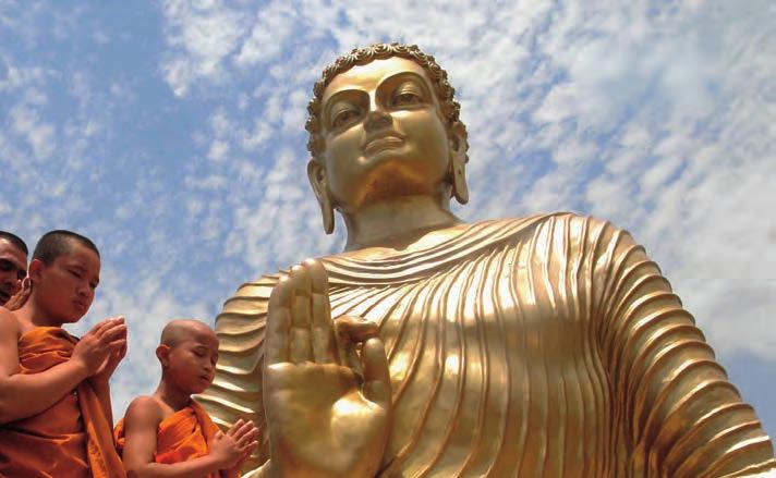 MAIN IDEA Buddhism emerged in India around 500 B.C. Buddhist monks pray before a statue that represents the Buddha.