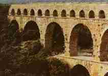 They built stone structures called aqueducts to carry water. The aqueducts went through mountains, across valleys, or even across towns. The Romans made more than 200 aqueducts.