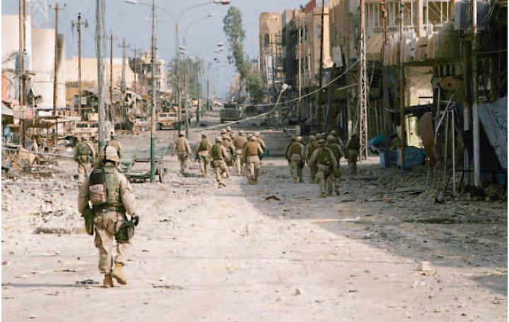 MOUT U.S. Marines and Iraqi Special Forces conduct a security patrol in the war-torn city of Falluja, November 23, 2004.