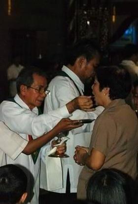 The New Mass implements Communion in the hand in almost every place in the world, and it even goes farther by
