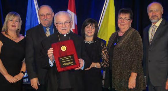 Michaud accepting on behalf of Fay Cailliau (Holy Family), Gerald
