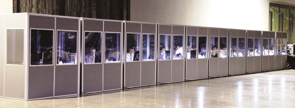 Interpreters: A Technological Pentecost Eleven gray booths lined up inconspicuously against the right-hand wall of Hall 9 of the Impact Center.