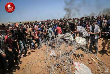 4 Right: Palestinians riot near the security fence east of Gaza City (Safa Twitter account, May 14, 2018).