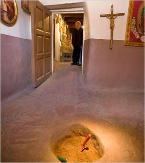Here a circular hole in the ground, reveals the Holy Dirt, El Posito.