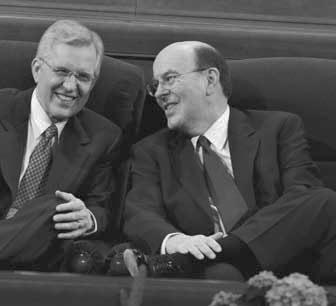 The two newest members of the Quorum of the Twelve Apostles, Elder D. Todd Christofferson (left) and Elder Quentin L. Cook, exchange greetings.
