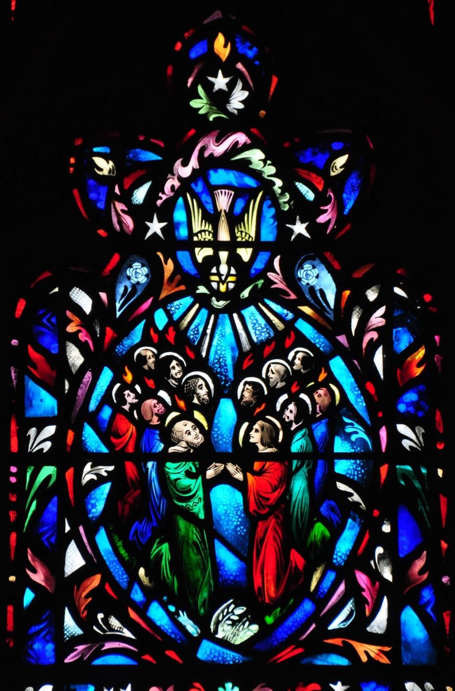 The East Lancet The panel at the right is devoted to the Holy Spirit. At the base is the Annunciation to Mary with the dove of the Holy Spirit above. In the field below is a little figure of St.