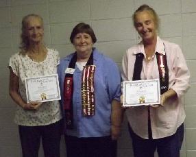 President Shirley Edberg presented UDC membership certificates to Suzan Stokes Smith and to Christine Bearrentine, whose certificate was accepted by her mother, Donna Smith.