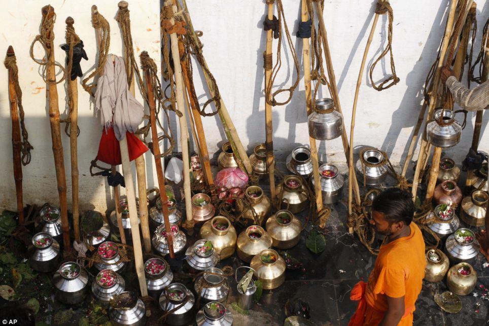 Sacrifice: Metal canisters are kept on the ground outside the Padilla Mahadev temple,