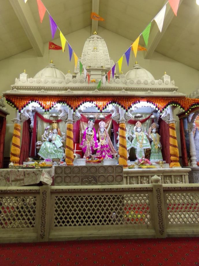 The most sacred space inside a mandir is the area where the altars are. Statues of Hindu gods stand on the altars.