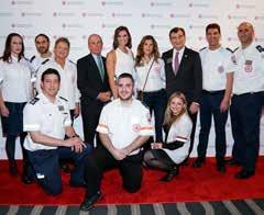 Bloomberg (back row, fourth from left) and AFMDA Chairman Mark Lebow (back row, third from right) pose with MDA volunteers MDA volunteer Hananel Alvo, left, met AFMDA National Board member Donna